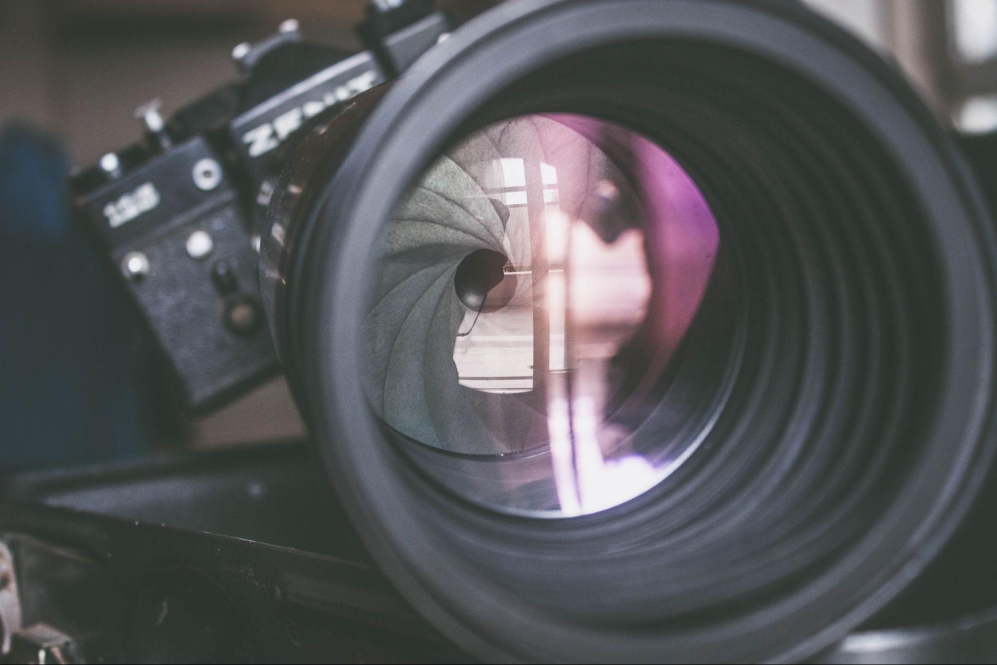 Close-up of a camera lens showing the aperture blades